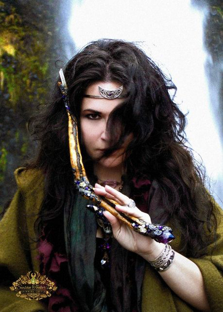 the high priestess holding a wand